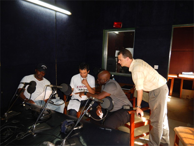 Fred and CDC epidemiologist Desmond work with Sierra Leonean recording stars Jimmy B. and Nasser Ayoub to record PSAs for the "Ebola Big Idea of the Week" campaign.