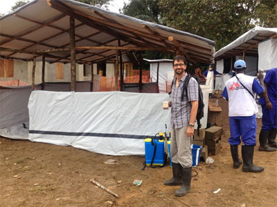 Jose standing outside the treatment center in Rivercess County, Liberia.