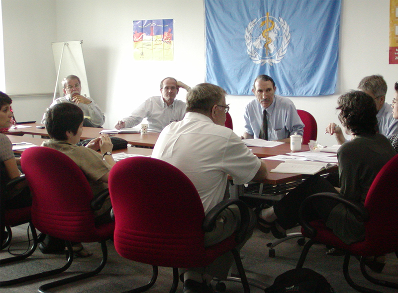 World Health Organization China Office – team lead meeting, May 2003. CDC’s Anne Schuchat, MD, is seated at the head of the table (near right).