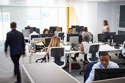 Office floor showing people working at their desks