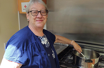 Donna Perreca prepares food in the kitchen at Jawonio Early Education Program where she works as chef.