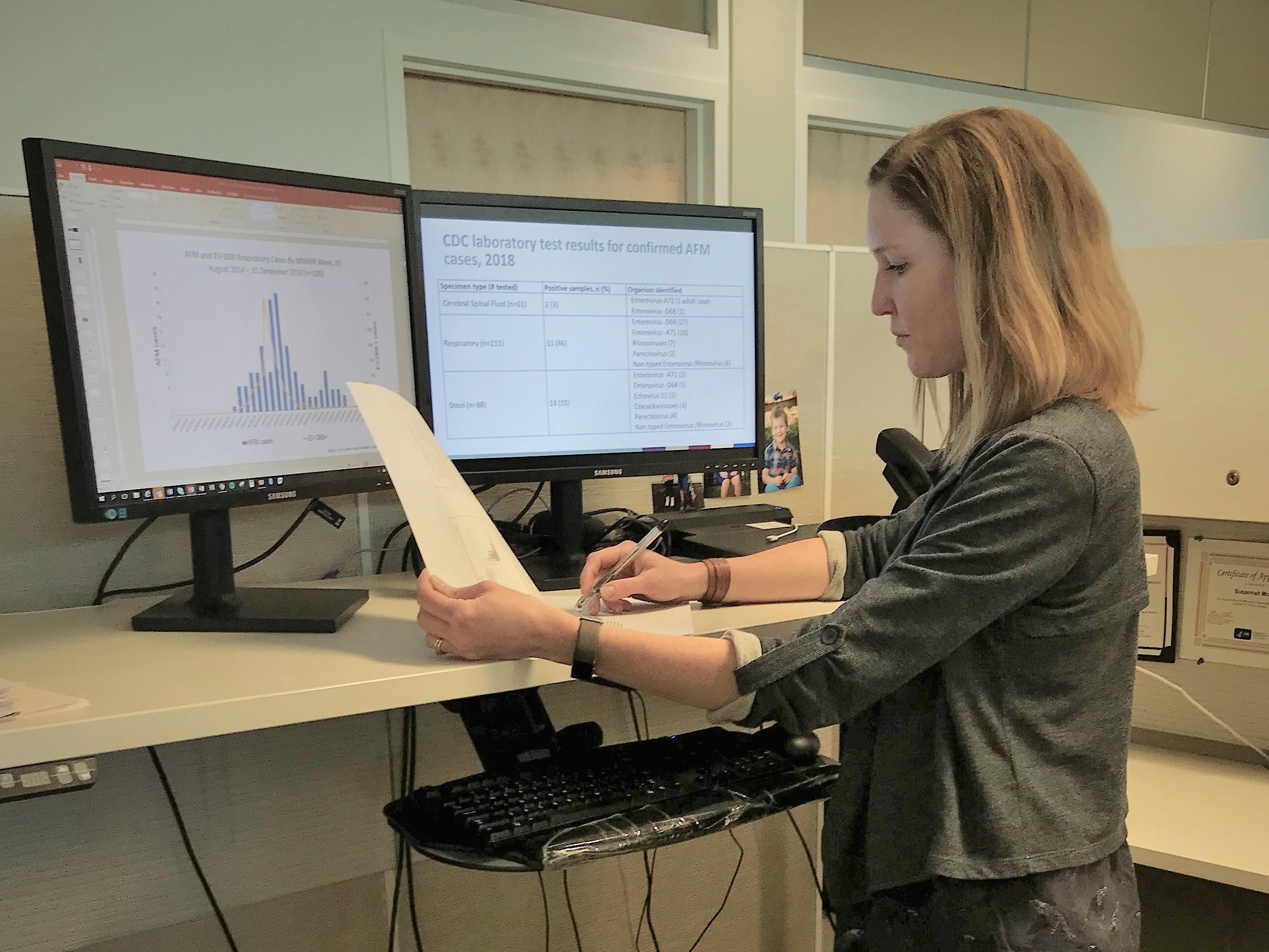 EIS officer Susannah McKay, PhD, MPH, works at her desk