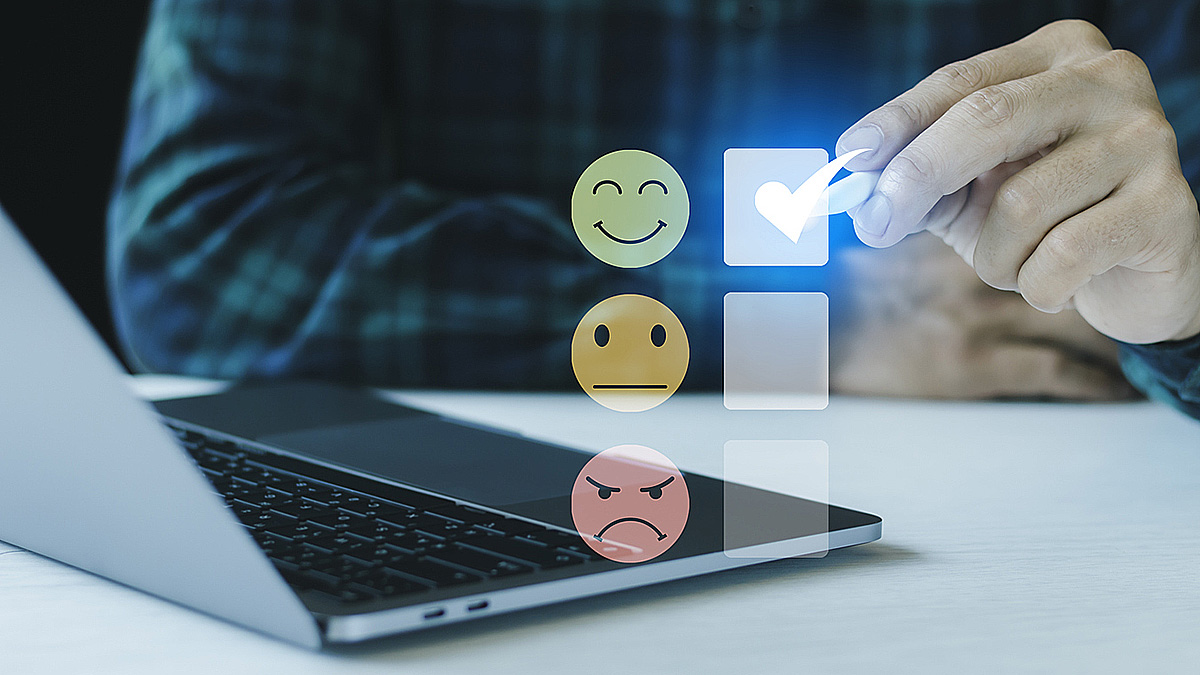 Illustration of man filling out a happiness survey by checking a happy face box and not an indifferent or frowning face