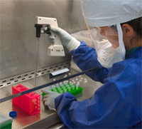 h7n9-scientist-lab.jpg A CDC scientist uses a pipette to transfer H7N9 virus into vials for sharing with partner laboratories for public health research purposes.
