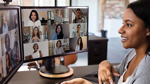 Woman having a video conference call with team members.