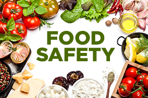 The words Food Safety surrounded by various vegetables