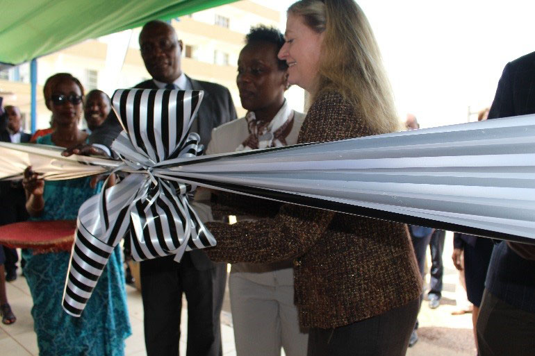 Amb Barks-Ruggles and Hon. Min. Gashumba cut the ribbon to officially open the AfSBT-RBC Collaborating Center.