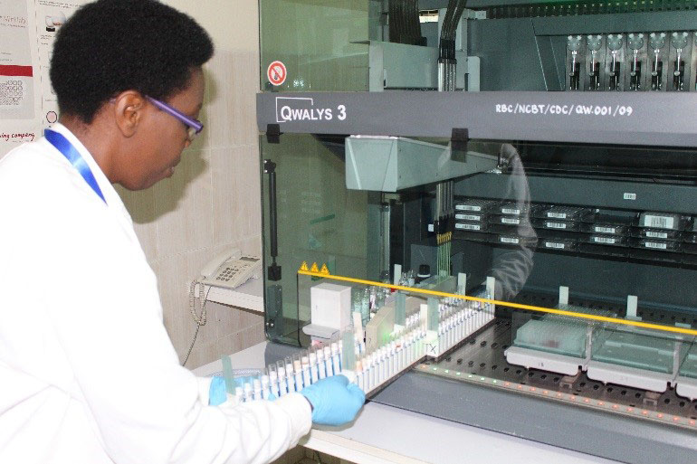 An NCBT staffer uses one of the machines provided by CDC through PEPFAR.