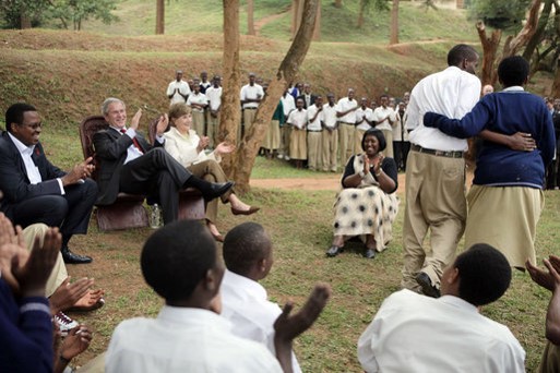 President Bush and Rwanda Minister of Health watch a skit by Lycee de Kigali High School’s ‘Anti-AIDS Club’