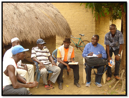 Dr Rukelibuga of CDC Rwanda meeting with community leaders in Katongor, Guinea as part of the Ebola outbreak investigations.