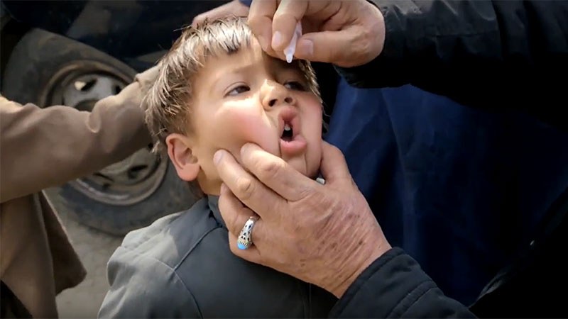 child receiving medicine