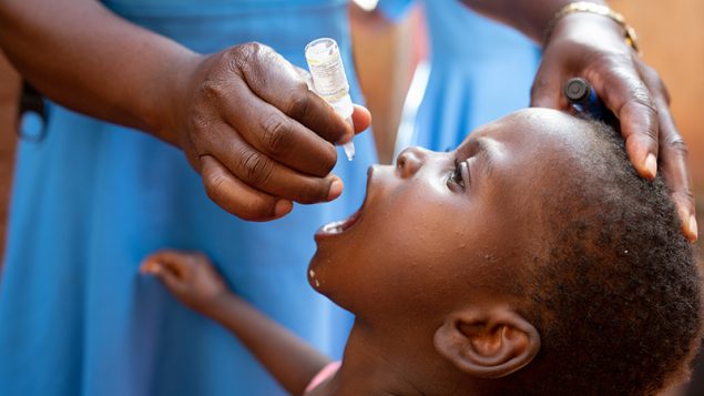 Child taking a vaccine