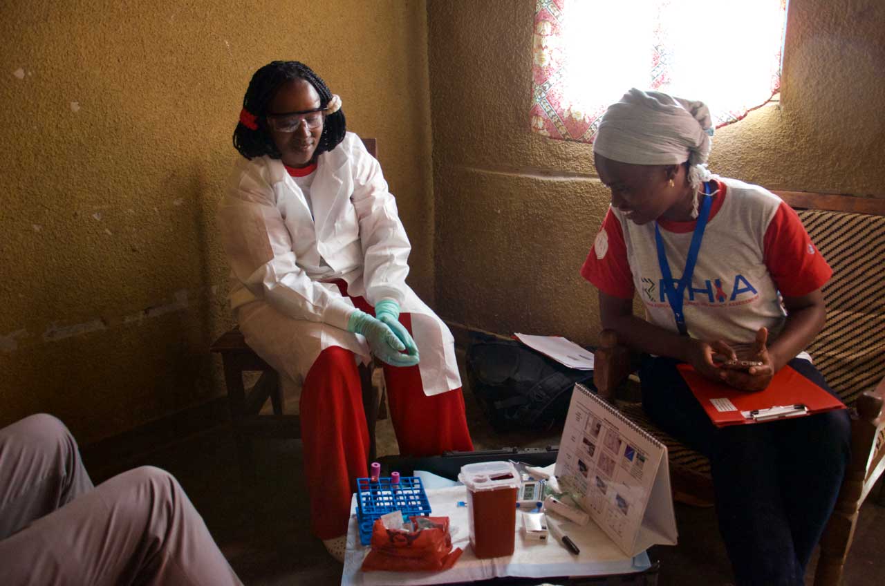 Community workers in a local citizen’s home after collecting blood samples