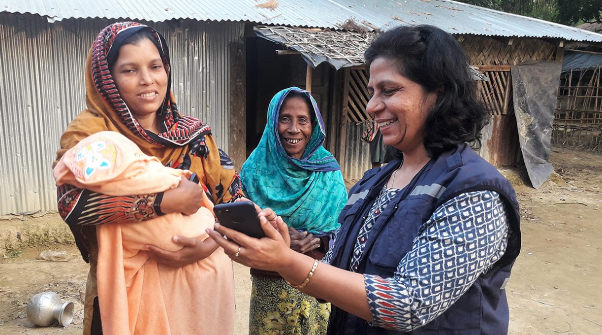 A field epidemiologist conducts a diphtheria risk assessment while deployed to Cox’s Bazar to assist in delivering healthcare to Rohingya refugees.