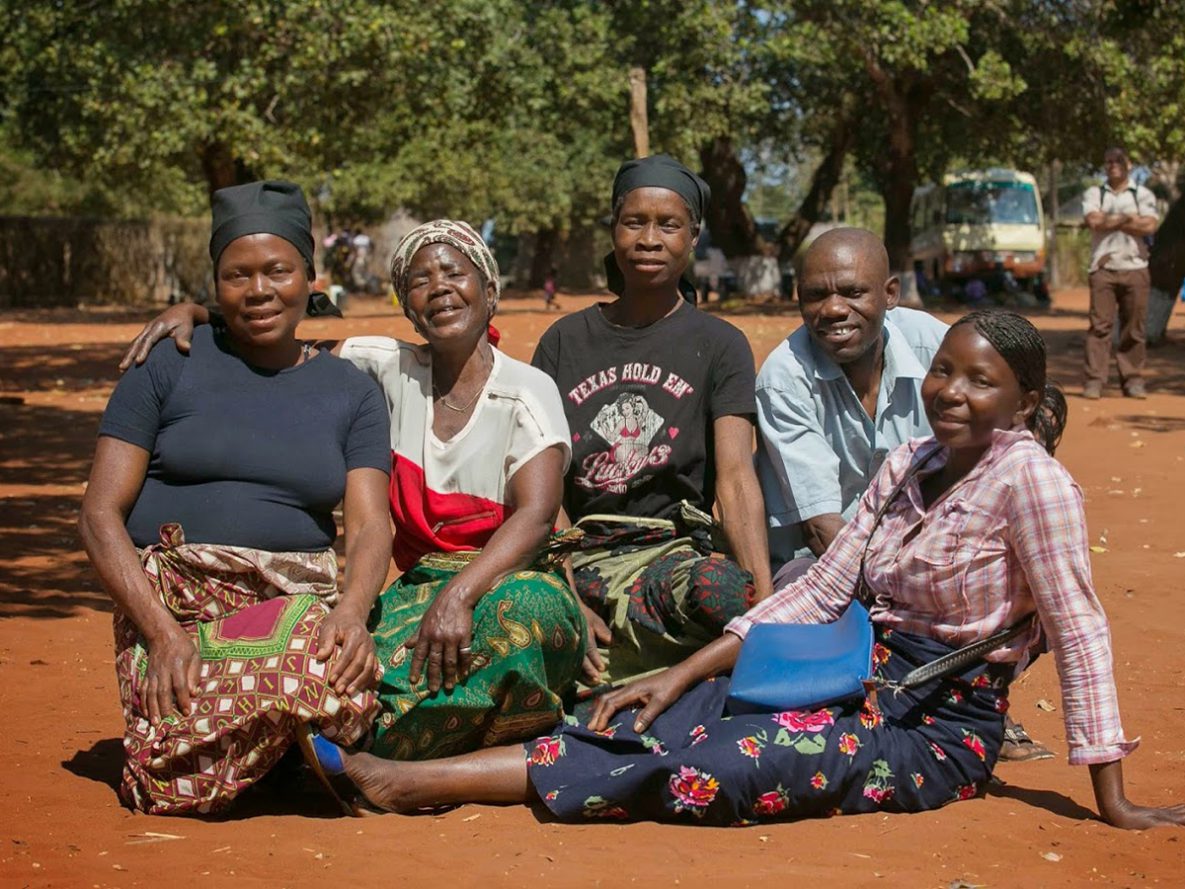 On a rotating basis, these members of a community support group in Mozambique collect and distribute HIV medications to each other, which helps them to maintain their treatment.