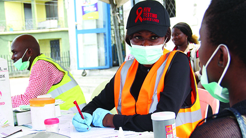 A young person gets an HIV test at an open-air testing site in the Rivers State, Nigeria.