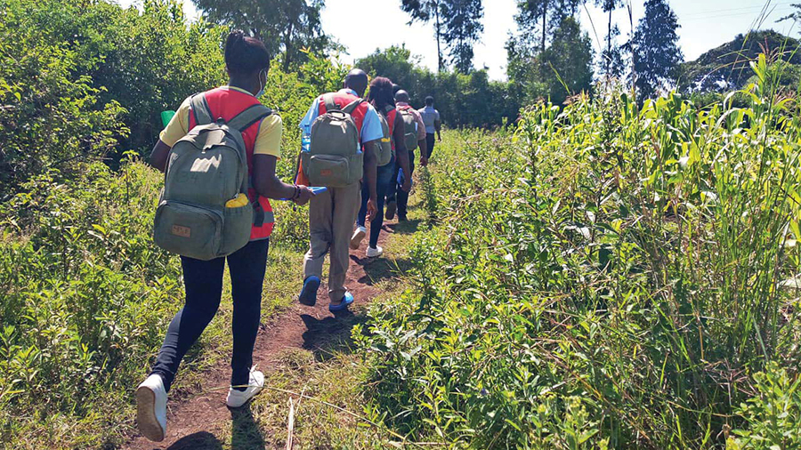 A household survey team heading out to a study village on an island in Lake Victoria.