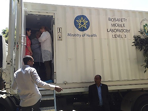 Biosafety and biosecurity experts in Ethiopia prepare to assess a BSL-3 mobile laboratory to assist in preparing a biorisk plan for the facility.