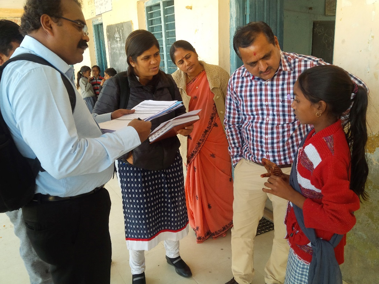 An India EIS officer helps the district rapid response team take interviews after a food poisoning outbreak in Gujarat. Photo courtesy of Mayank Dwivedi.