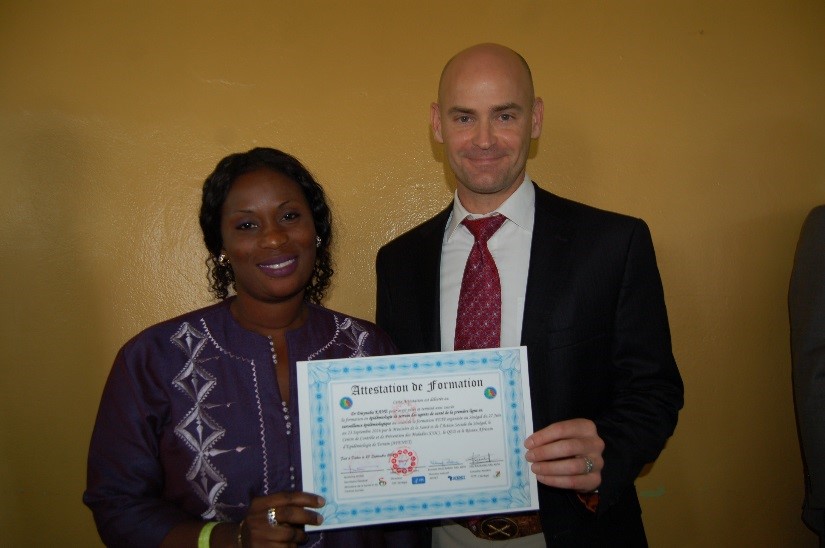 Dr. Dieynaba Kane at the FETP Frontline graduation ceremony with CDC Senegal Country Director, Dr. Michael Kinzer