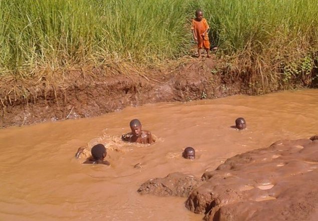 Children taking a bath at Kajana village, March 2017