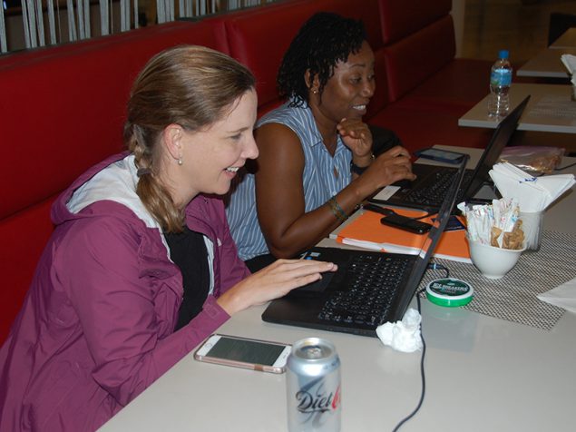 Valerie Bampoe and Alison Winstead reviewing final slides for a Waterborne Disease Outbreak Investigation training to be delivered to the Sierra Leone FETP residents.