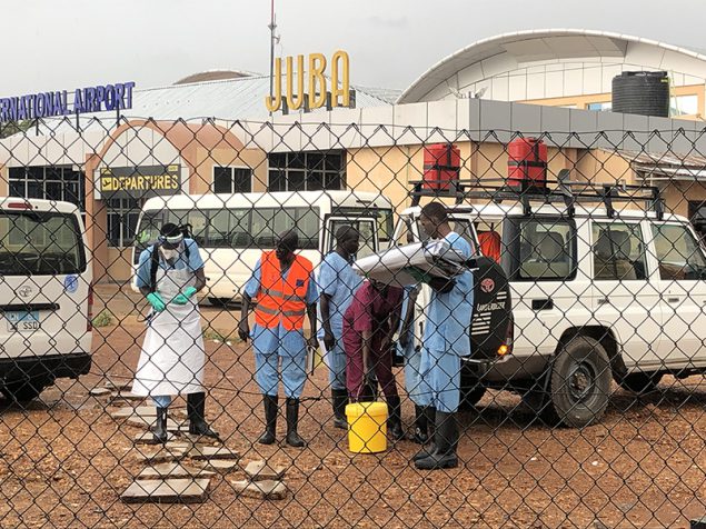 Members of the national rapid response team preparing to investigate a “suspect” Ebola patient at Juba International Airport during the simulation exercise. Photo by Aimee Summers