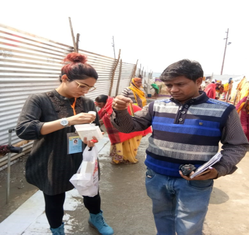 (India EIS Officer from NCDC is testing the water quality in the Kumbh Mela area. Photo credit: Dr. Rajesh Yadav)