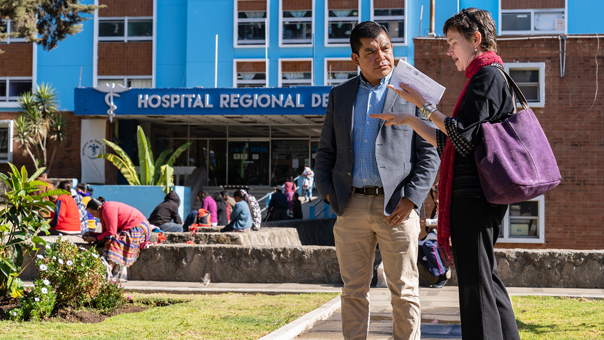 Dr. Emily Zielinski Gutiérrez, regional director of CDC’s Central America Regional office, speaks with Dr. Giovanni Ortega, the director from the Hospital Regional de Occidente in Quetzaltenango, Guatemala, about how they can use surveillance data. The CDC Central America Regional office is based in Guatemala and has collaborated with local partners in Central America since the 1960s.