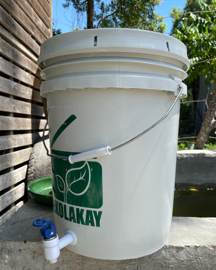This bucket with a spigot is a handwashing station provided by the non-profit organization SOIL in Haiti.