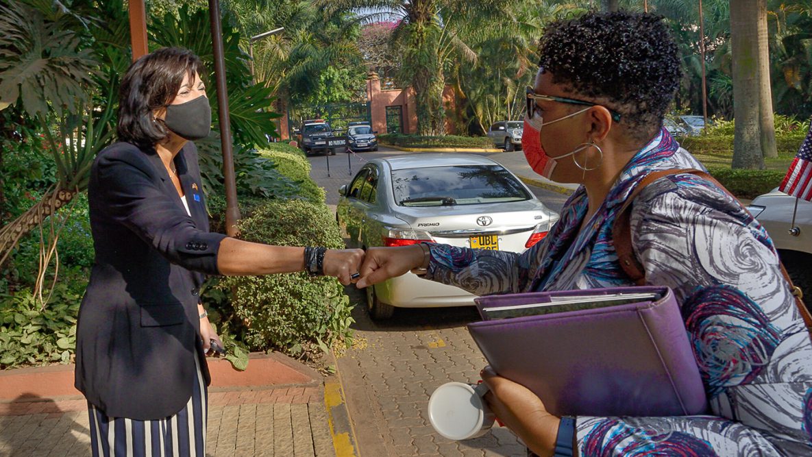 CDC director, Rochelle Walensky, MD, MPH, (left) greets Natalie E. Brown, U.S. Ambassador to Uganda in Kampala.