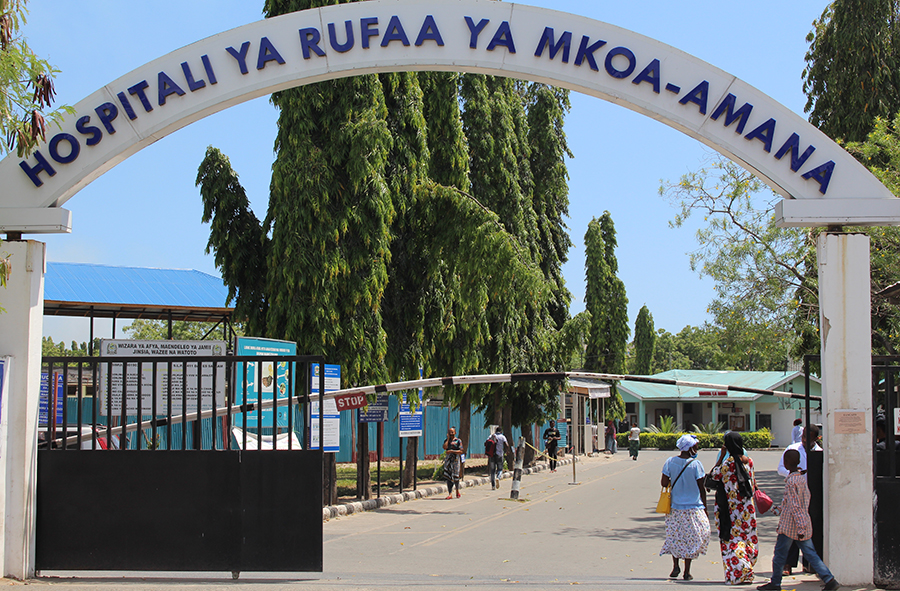 Patients crossing the entrance gate of Amana Regional referral hospital.
