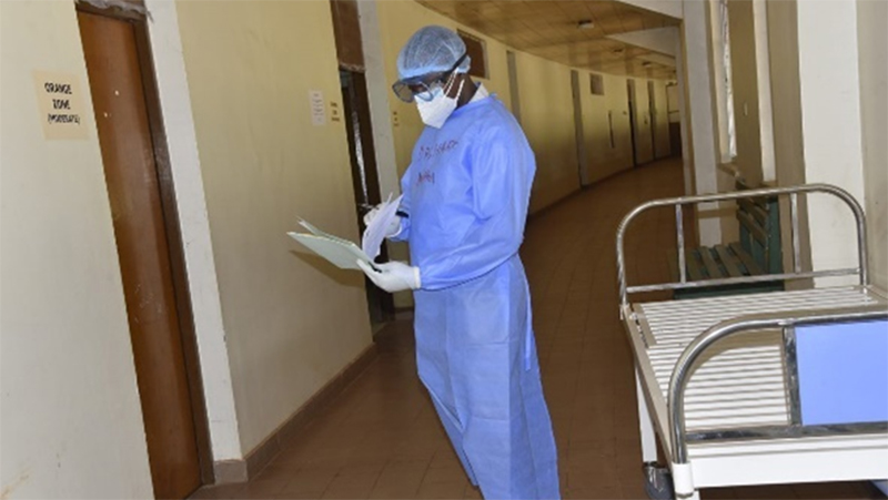 A doctor reviews a patient’s records