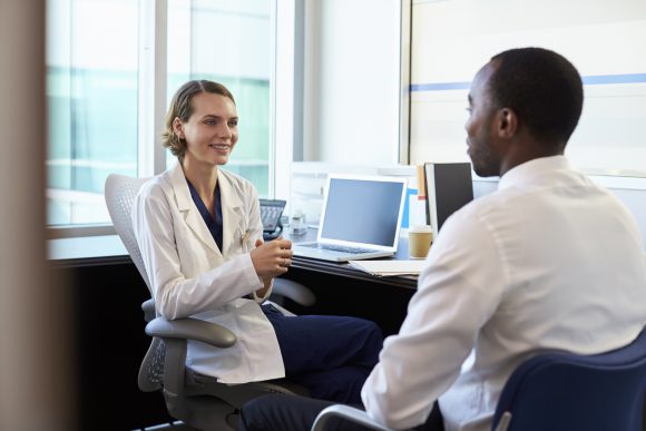 doctor speaking with patient