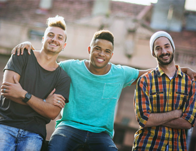 Three men, smiling