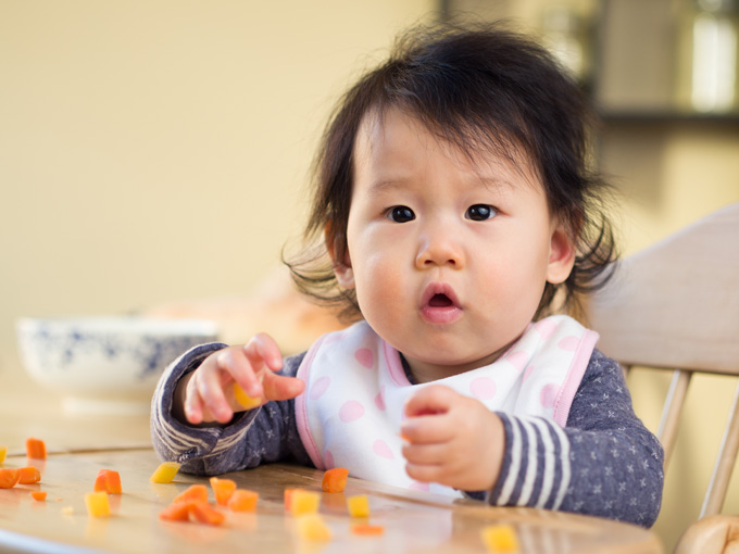 baby eating fruit