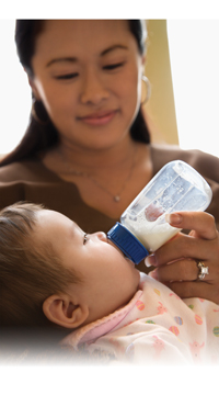 woman feeding baby