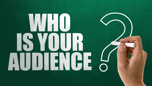 Large white letters written on a green chalk board that say Who is your audience?