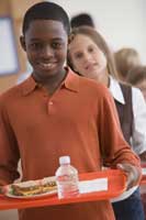 boy holding lunch tray