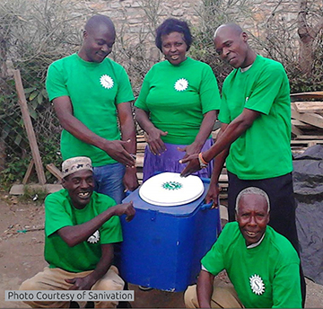 People showcasing a portable toilet