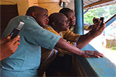 Water analysts read results of a water quality test