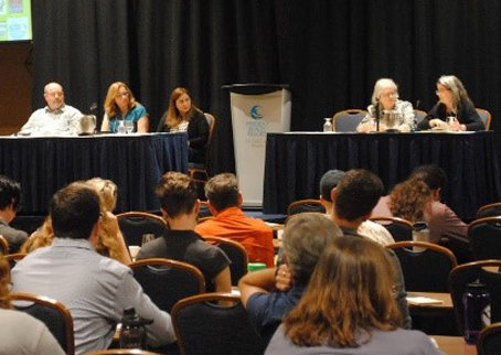 panel of speakers at a symposium