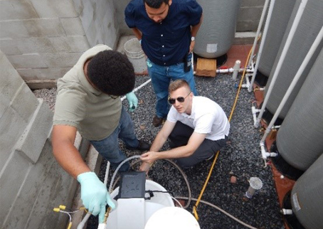 two people testing well water