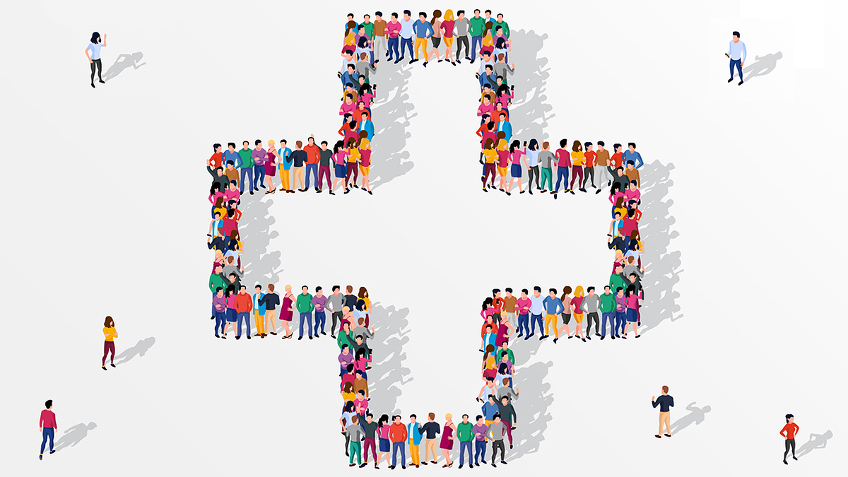 Large group of people who, when viewed from above, are creating the shape of a medical cross.