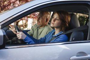 father and daughter driving