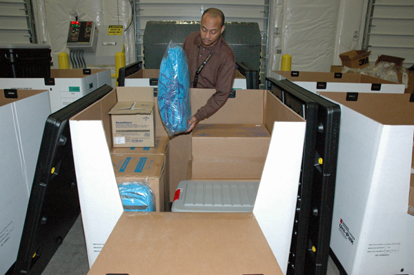 CDC personnel are assembling product from the Strategic National Stockpile into an individual personal protective equipment kits, each of which can be used to care for one Ebola patient for up to five days.