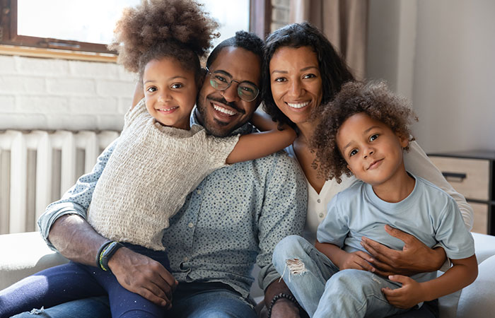 A happy healthy family sitting together