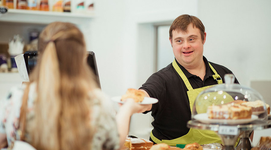 Man with a disability working at a bakery