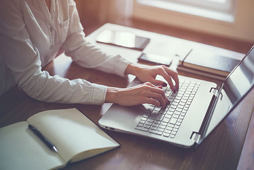 A woman working on her computer