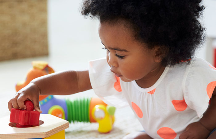 Young girl playing with blocks